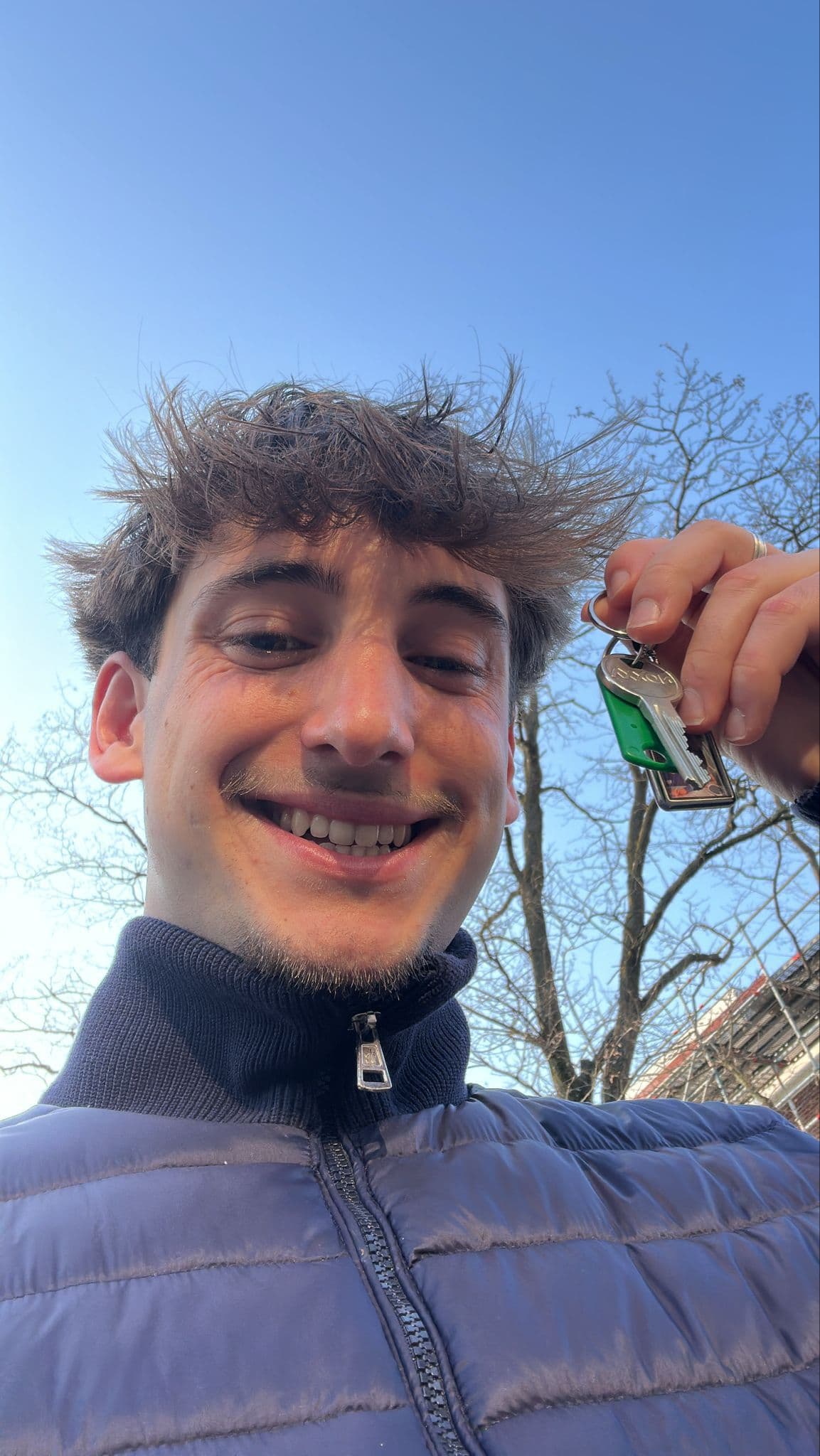 Student holding keys to new student accommodation